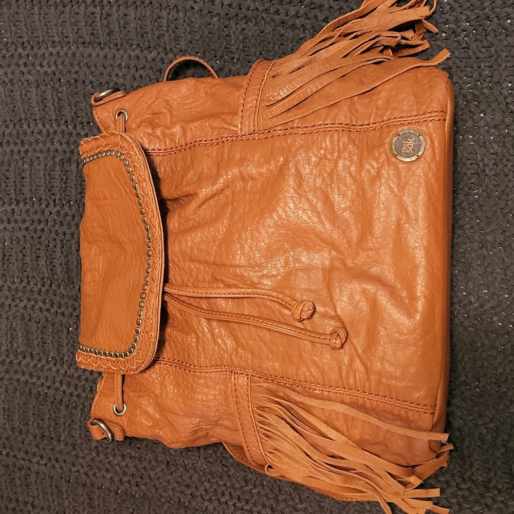The Sak Orange Backpack with Fringe